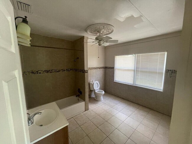 Building Photo - Charming Haven: Uncover Your Dream Home at...