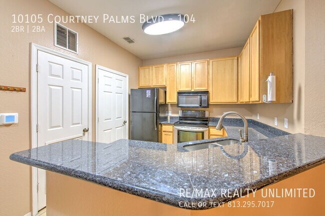 Building Photo - 10105 Courtney Palms Blvd