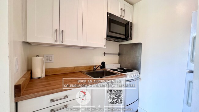 Building Photo - Beautiful sunny top floor condo, includes ...