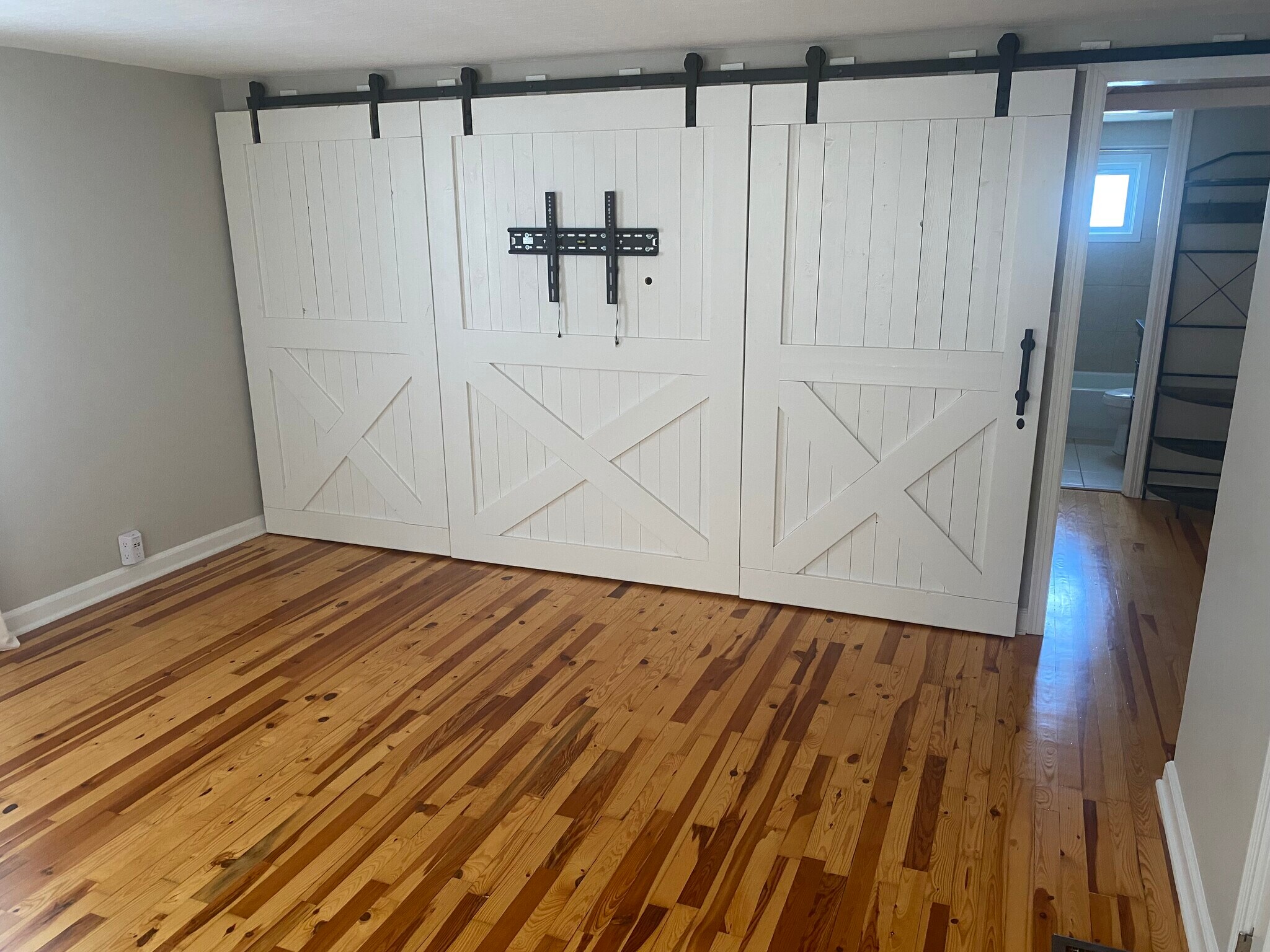 Master bedroom with custom barn door wall - 644 Mohican Ave