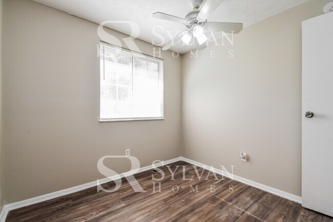 Building Photo - The living is easy in this 4 bedroom, 2 ba...