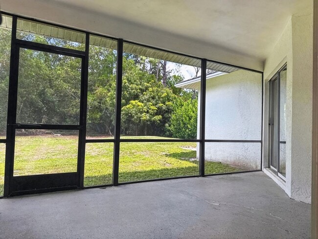 Building Photo - Annual rental offering privacy and space on 1.14 acres in Naples!