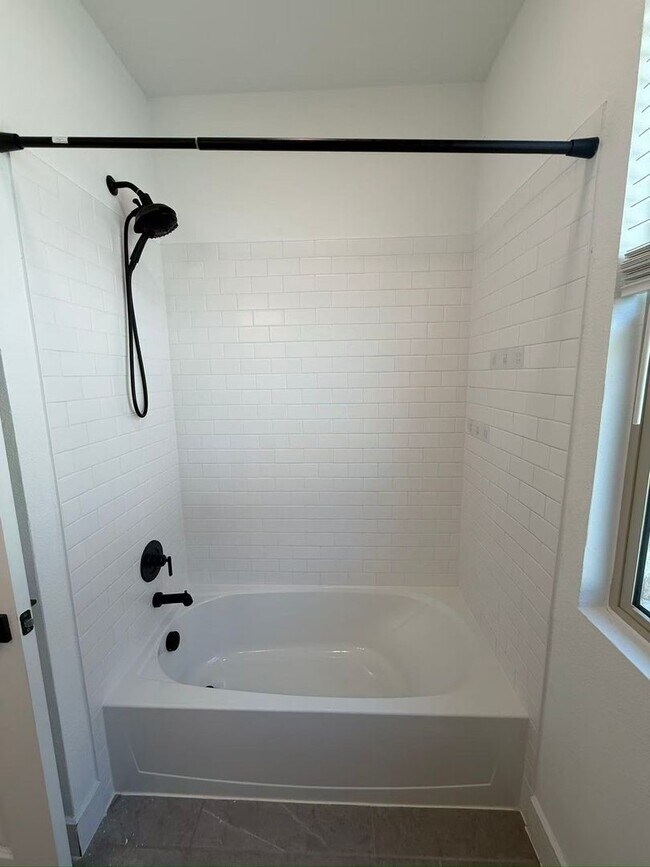 Building Photo - Move-in ready and like-new! Washer, dryer, and refrigerator Included.