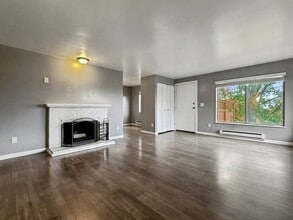 Building Photo - AVAILABLE NOW! Charming West Seattle Home featuring a garage, spacious deck, and wood-burning fir...