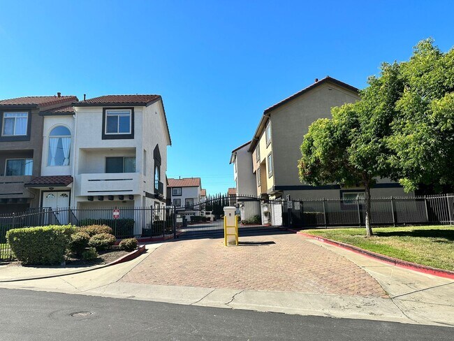Building Photo - Gated Hayward Townhome with 2-Car Garage & Private Patio