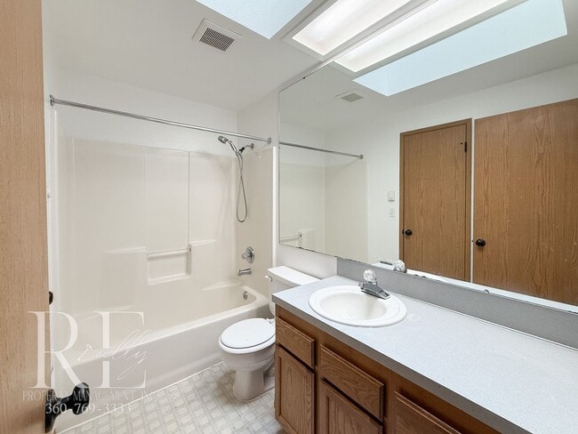 Building Photo - Vaulted Ceilings, Skylights & a True Primary Suite in This Gig Harbor Duplex