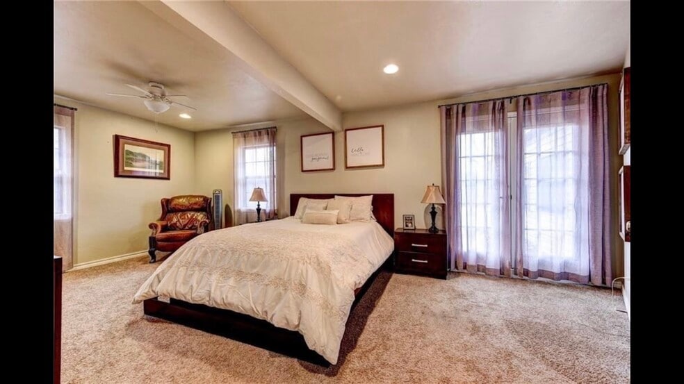 Master bedroom with 2 closets and french doors that lead out to backyard. - 2056 NW 48th St