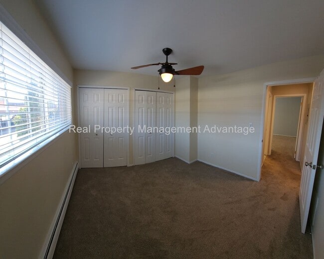 Building Photo - Spacious, Updated Condominium with Two Ful...