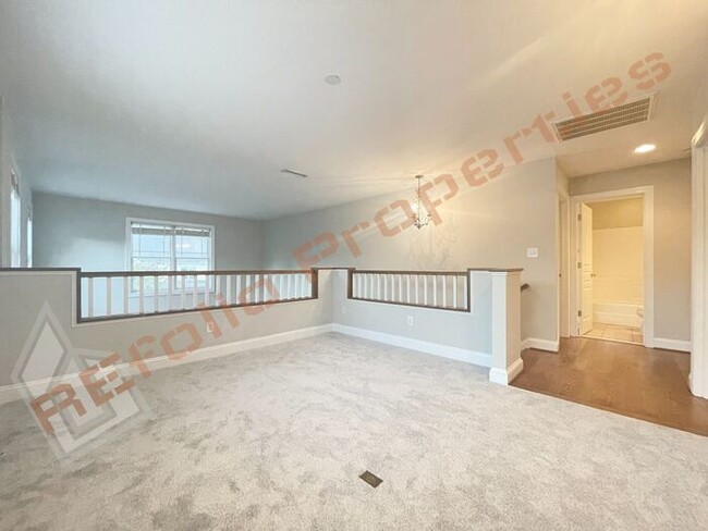 Building Photo - Freshly Painted with New Carpet and Wood F...