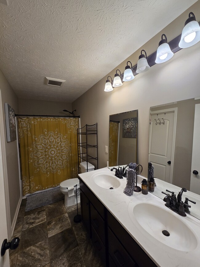 Upstairs Full Bathroom with a large utility closet - 898 Loebner Ave