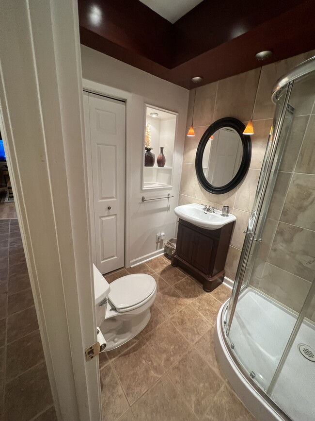 Bathroom with closet, shower only, and vanity. - 3617 Sunset Rdg