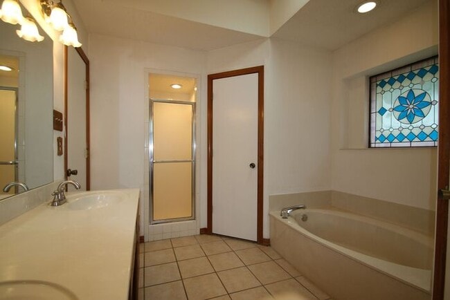 Building Photo - Corner Lot Charmer Off Chapel Creek | 4BR/2BA with Fireplace, Garden Tub & Fenced Backyard
