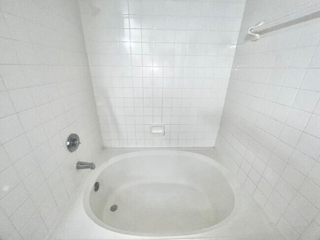 Building Photo - NEW-Remodeled bathroom & kitchen! NEW VINYL PLANK flooring & fresh paint! 2 bedroom 1 bath condo ...