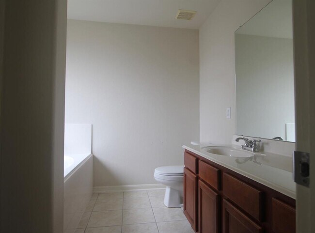 Building Photo - 9414 Coatsworth Dr