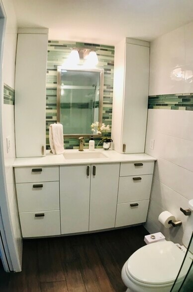 Bathroom features ample counter space and storage in - 15 S Golfview Rd