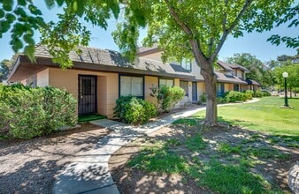 Building Photo - One Story Two Bedroom plus Den Townhouse