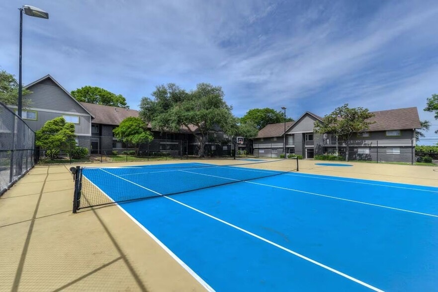 Experience the vibrant lifestyle at Distinction Apartment Homes, where leisure meets convenience. Enjoy our pristine tennis courts, perfect for an afternoon match. Elevate your living experience today—schedule a tour to see for yourself! - Distinction Apartment Homes