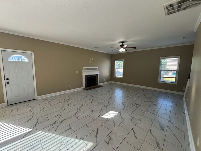 Building Photo - This property blends ample living space and storage with functional amenities.