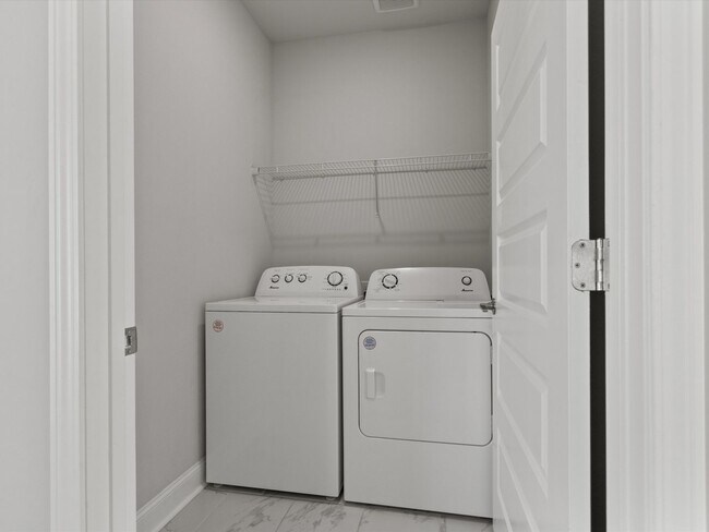 Building Photo - 3 Car Garage! Modern end-unit townhome located in the desirable Clift Farm!