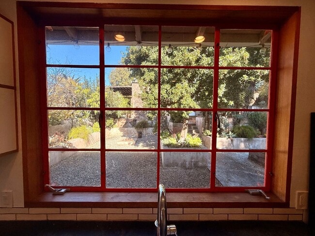 Building Photo - Hilltop Highland Park Sanctuary with Views, Private Gated Yard, In Unit Laundry, Parking & Abunda...