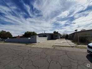 Building Photo - 4 bedrooms and 2 bathrooms with A/C.