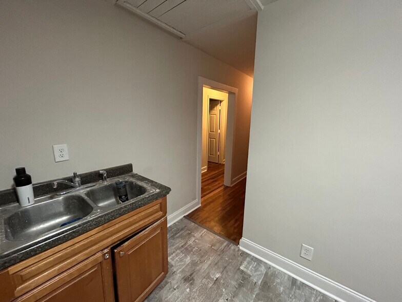 Kitchen leading to both hallways - 305 Orange St