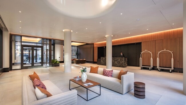 Welcome to Mabel, where modern design meets comfort. Our inviting lobby features stylish furnishings and warm lighting, creating the perfect environment for relaxation and connection. Explore what Mabel has to offer today! Schedule a visit now. - Mabel Chelsea