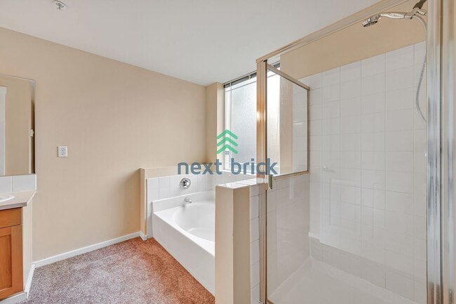 Building Photo - Rare Ground-Floor, End Unit with massive b...