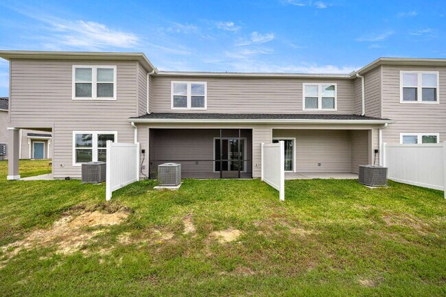 Building Photo - Be the First to Lease This 3BR Townhome in Marion Ranch | Loft + Garage + Screened Lanai + Includ...