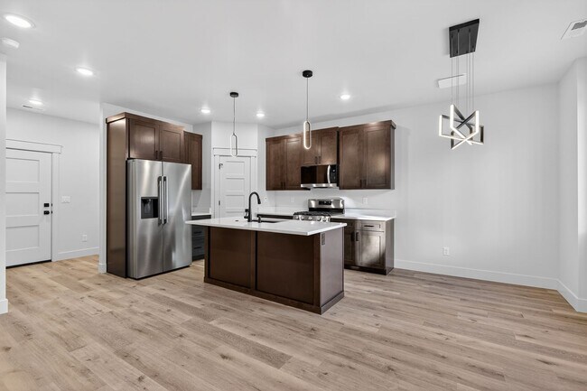 Building Photo - $300 off first month for February move-ins - BRAND NEW 3 BED 2.5 BATH TOWNHOMES WITH 2 CAR GARAGE