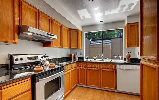 Building Photo - View Townhome Overlooking Genesee Park, Private Patio, Decks & Garage Parking