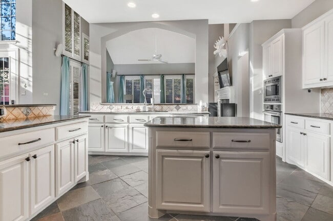 Building Photo - "Stunning Partially Furnished 5-Bedroom Home with Pool & Outdoor Living Center!"