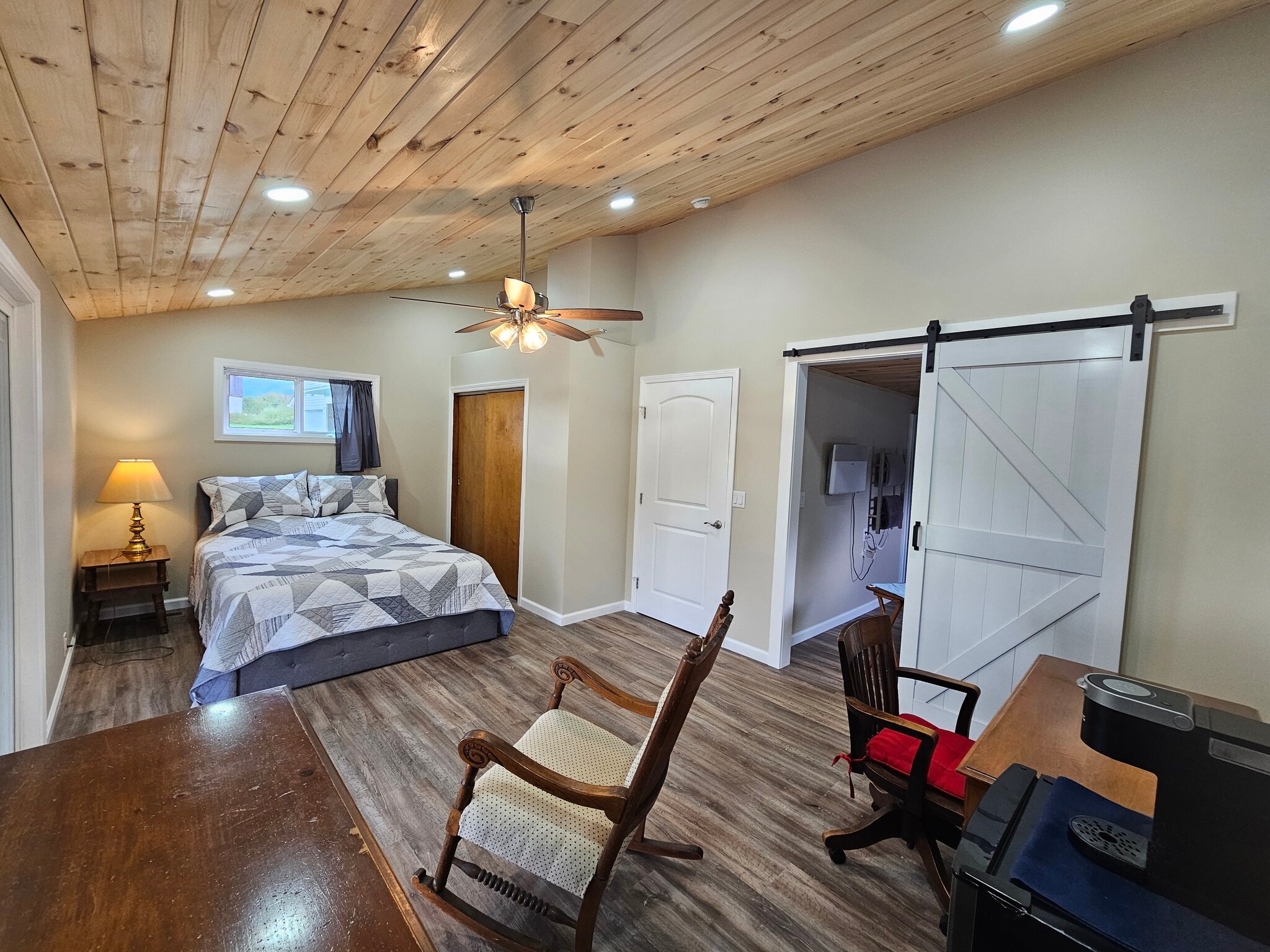 View towards Barn Door entry to Primary Bath with Privacy Door that leads to the Kitchen to left - 8152 Wilson Karr Rd