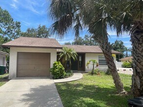 Building Photo - Open and bright 2/2 with garage