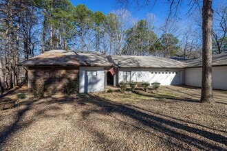 Building Photo - Discover this unique, single-level townhom...
