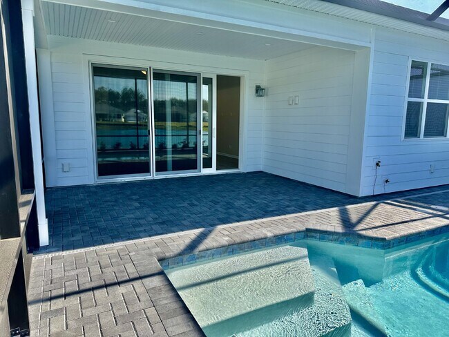Building Photo - Gorgeous Home with a Private Pool Ready to...