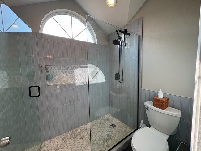 Custom tile walk in shower with glass wall - 6337 Hillman Pl NE