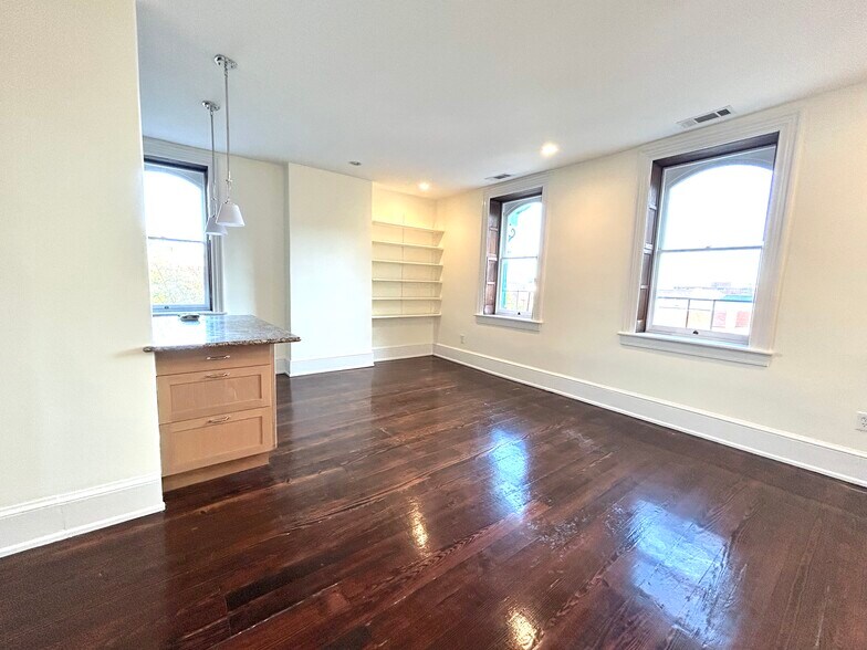Living room (partial view) with open windows - 301 M St NW