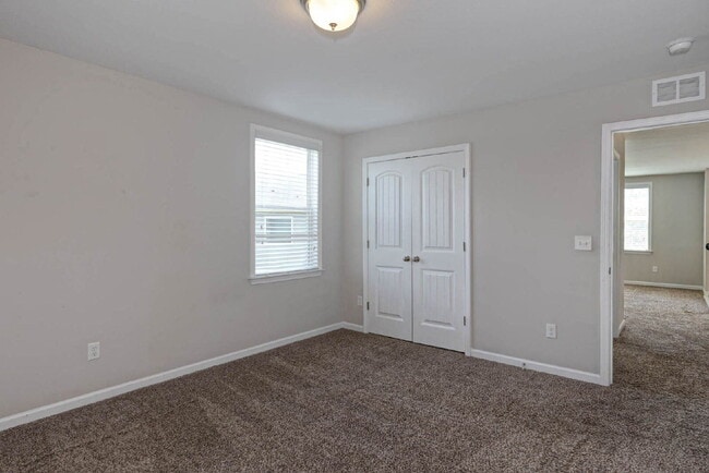 Building Photo - 4BR/3.5BA · 2,809 SF · Owner's Suite on Main · Fenced Yard · Midland, GA — $2,800/mo