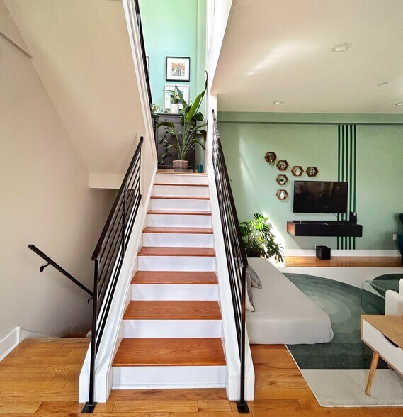 Staircase leading up to rooftop deck - 14 W Thompson St