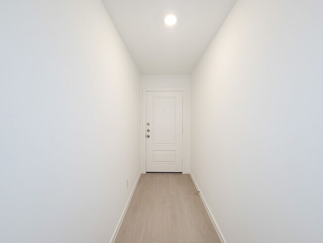 Building Photo - This single-level home showcases a spacious open floorplan shared between the kitchen, dining are...