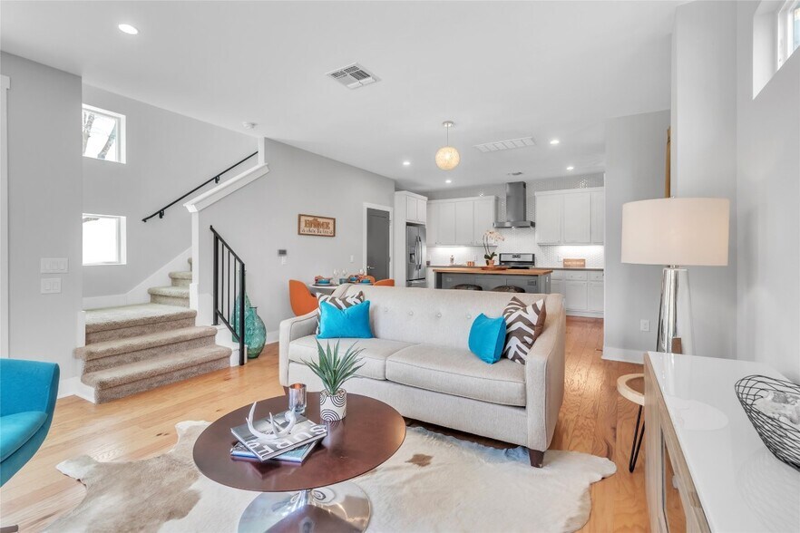 Living room, stairs to 2 bedrooms/bath and office area, half bath off the kitchen - 402 Irma Dr