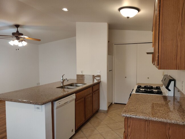 Building Photo - 2x2 duplex with a fenced yard, single-car ...