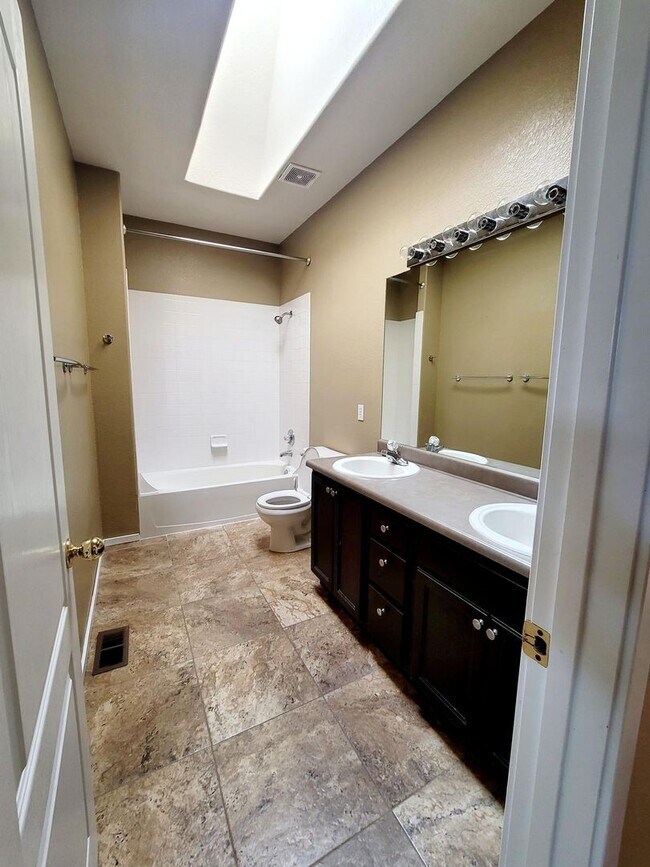 Building Photo - Boastful 3 Bedroom West Side home in gated...
