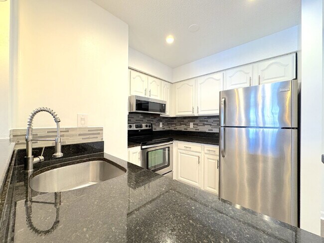 Building Photo - Stunning Top-Floor Penthouse Condo – Loaded with Luxury Upgrades!