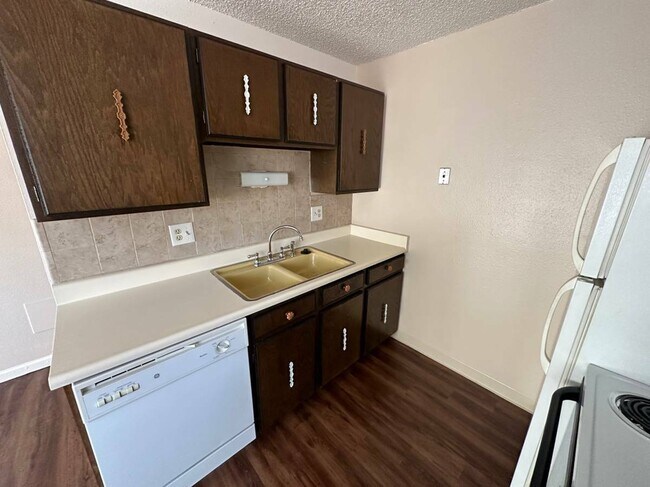 Explore the warmth of this inviting kitchen, perfectly blending style and function. - Country Club