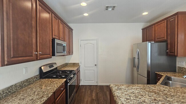 Building Photo - Spacious 4 Bedroom Home with Open Layout & Stunning Backyard