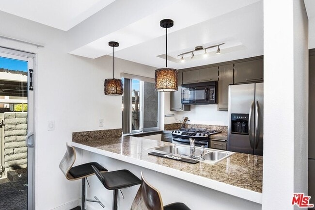 Building Photo - Furnished (also available unfurnished - please inquire) 3-Bedroom Townhome in a Gated Palm Spring...