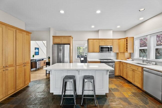 Building Photo - **Spacious 4-Bedroom Craftsman Home on Awb...