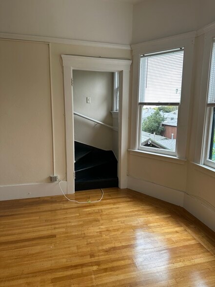 Staircase in living room leading to extra room in attic - 2738 Garber St